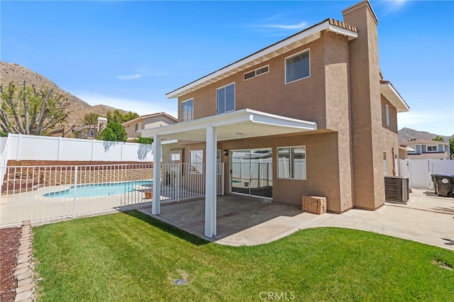 22710 Robin Way, Grand Terrace, CA 92313 - rear view of house featuring stucco siding, a fenced backyard, and a patio
