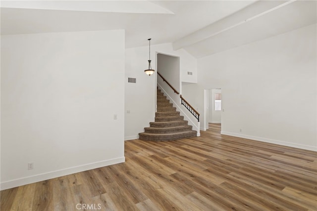22710 Robin Way, Grand Terrace, CA 92313 - staircase featuring wood finished floors and high vaulted ceiling