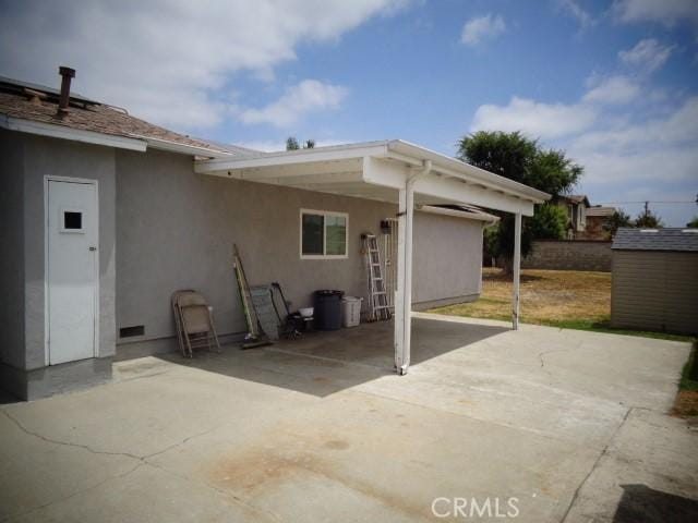 15728 Stevens Ave, Bellflower, CA 90706 - view of patio / terrace with a storage unit