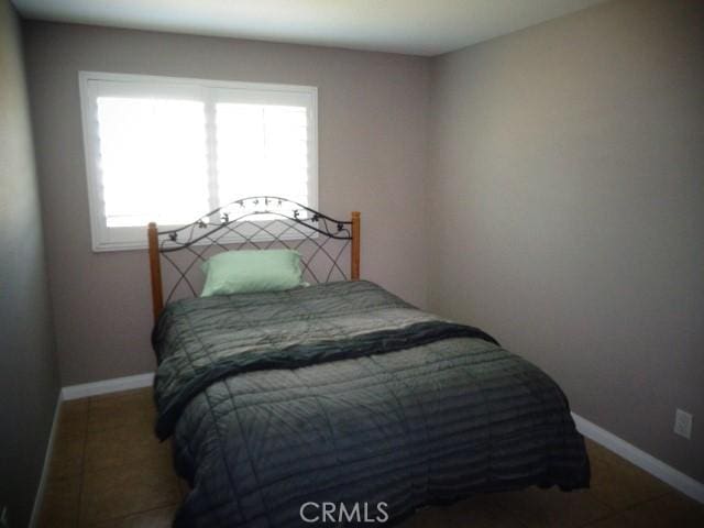 15728 Stevens Ave, Bellflower, CA 90706 - bedroom featuring baseboards and tile patterned flooring