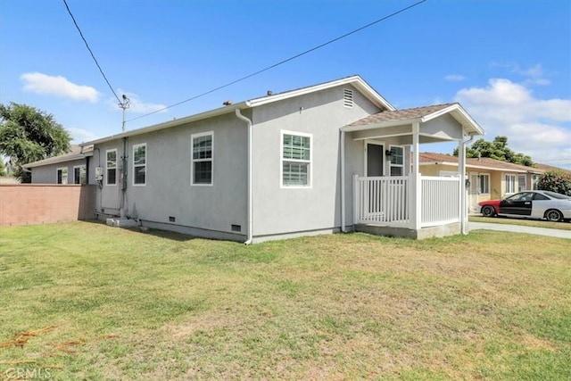 15728 Stevens Ave, Bellflower, CA 90706 - view of side of property with stucco siding, covered porch, and crawl space