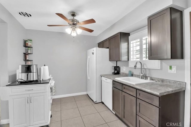 15728 Stevens Ave, Bellflower, CA 90706 - kitchen with white appliances, a ceiling fan, light tile patterned flooring, dark brown cabinetry, and light countertops