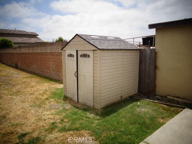 15728 Stevens Ave, Bellflower, CA 90706 - view of shed with a fenced backyard