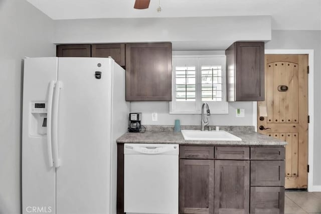 15728 Stevens Ave, Bellflower, CA 90706 - kitchen featuring white appliances, light countertops, dark brown cabinetry, and a ceiling fan