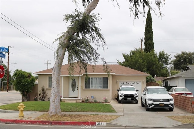 3641 W Oak Ave, Fullerton, CA 92833 - ranch-style house featuring a garage, driveway, stucco siding, and a front lawn