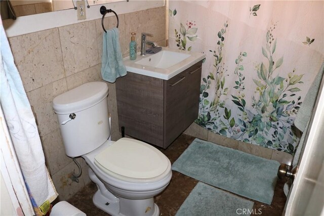3641 W Oak Ave, Fullerton, CA 92833 - bathroom with tile walls, vanity, and curtained shower