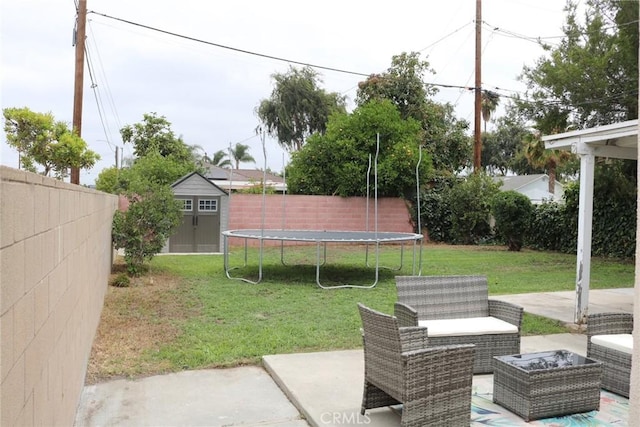 3641 W Oak Ave, Fullerton, CA 92833 - fenced backyard with a trampoline, a storage shed, a patio, and an outdoor hangout area