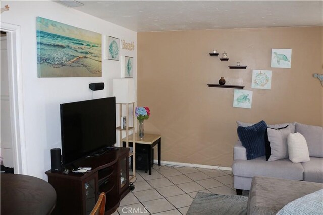 3641 W Oak Ave, Fullerton, CA 92833 - living room with light tile patterned floors and baseboards