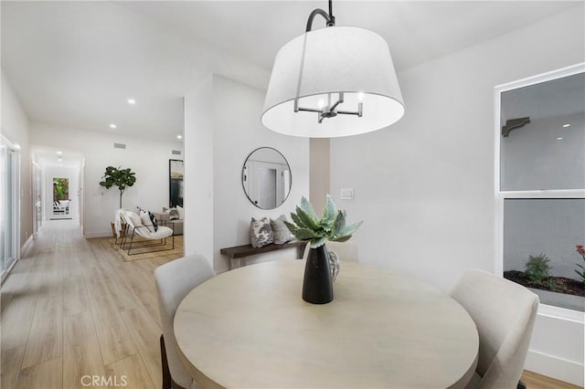 44 Seton Rd, Irvine, CA 92612 - dining room with light wood finished floors, a chandelier, and recessed lighting