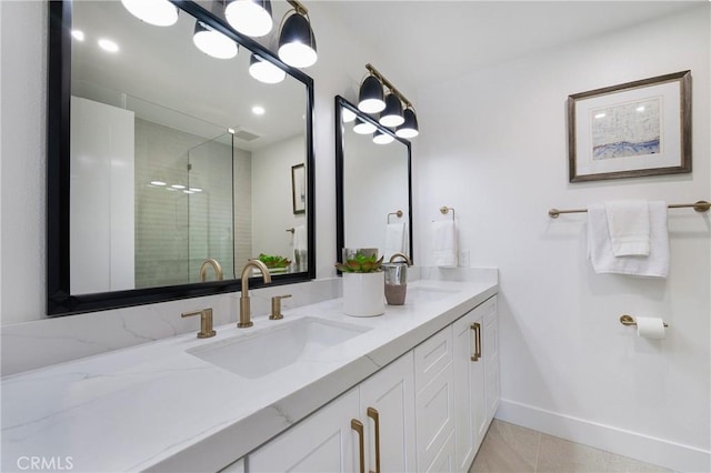 44 Seton Rd, Irvine, CA 92612 - bathroom featuring double vanity, a tile shower, tile patterned floors, and recessed lighting