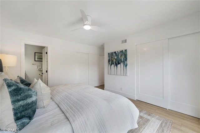 44 Seton Rd, Irvine, CA 92612 - bedroom with two closets, light wood-style floors, ceiling fan, and connected bathroom