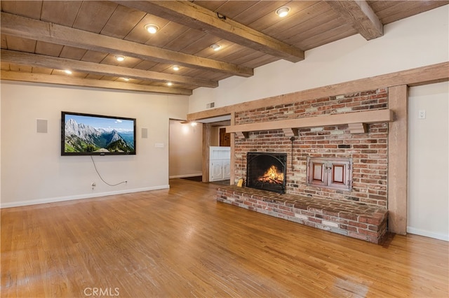 10430 Balboa Blvd, Granada Hills, CA 91344 - unfurnished living room with a wooden ceiling with exposed beams, wood finished floors, and a fireplace