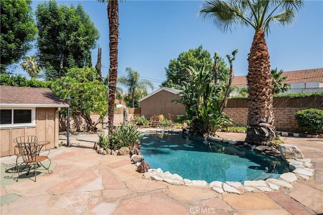 10430 Balboa Blvd, Granada Hills, CA 91344 - view of pool featuring a fenced backyard, a patio area, and an outdoor structure