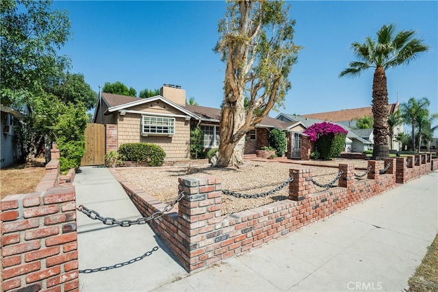 10430 Balboa Blvd, Granada Hills, CA 91344 - single story home featuring a chimney and a gate