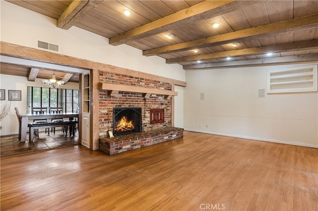 10430 Balboa Blvd, Granada Hills, CA 91344 - living room with a wood ceiling with exposed beams, wood finished floors, a chandelier, and a fireplace