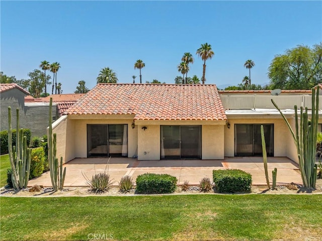 40316 Bay Hill Way, Palm Desert, CA 92211 - rear view of property featuring stucco siding, a tile roof, a patio area, and a yard