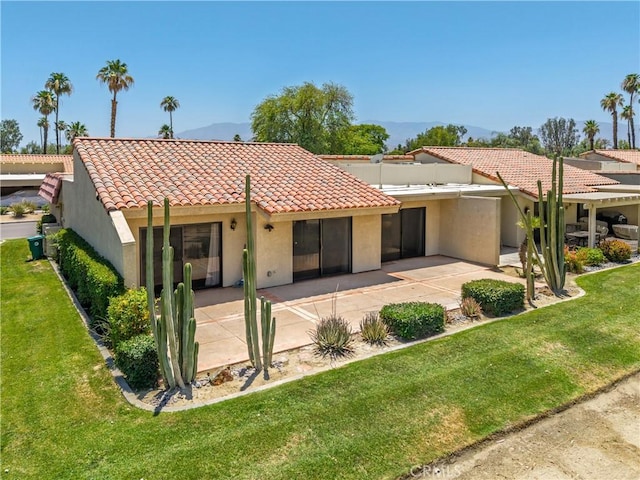 40316 Bay Hill Way, Palm Desert, CA 92211 - back of property with stucco siding, a tile roof, a patio, and a yard
