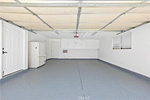 40316 Bay Hill Way, Palm Desert, CA 92211 - garage with freestanding refrigerator and a garage door opener