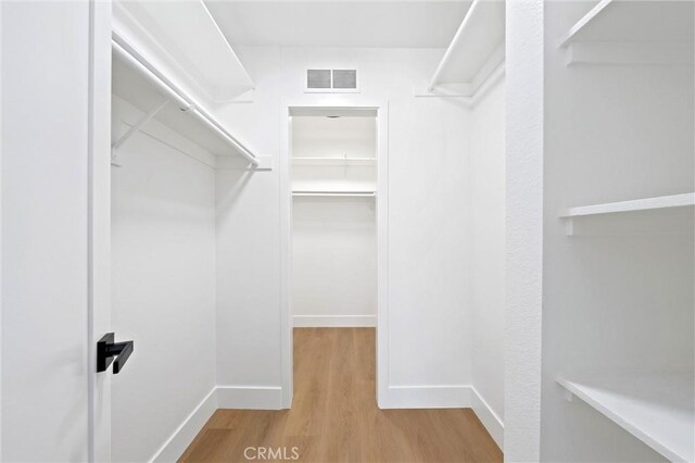40316 Bay Hill Way, Palm Desert, CA 92211 - walk in closet with wood finished floors