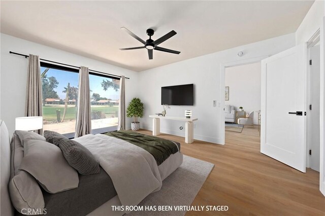 40316 Bay Hill Way, Palm Desert, CA 92211 - bedroom with light wood-style floors, access to exterior, and a ceiling fan