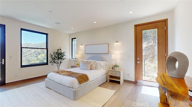 12480 Viewcrest Rd, Studio City, CA 91604 - bedroom with access to exterior, light wood-style flooring, and recessed lighting