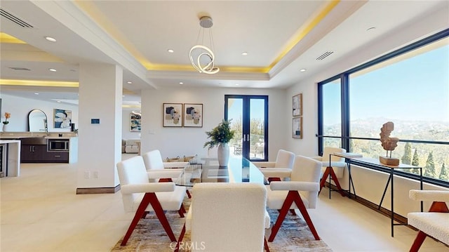 12480 Viewcrest Rd, Studio City, CA 91604 - dining room featuring a tray ceiling, recessed lighting, and french doors