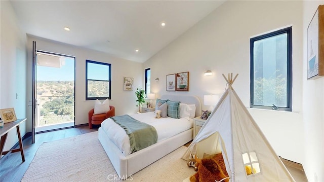 12480 Viewcrest Rd, Studio City, CA 91604 - bedroom featuring access to exterior, vaulted ceiling, recessed lighting, and wood finished floors