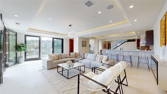 12480 Viewcrest Rd, Studio City, CA 91604 - living room with a tray ceiling, recessed lighting, and stairway
