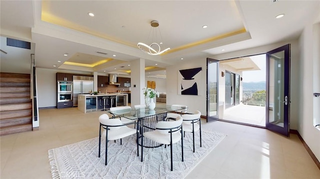 12480 Viewcrest Rd, Studio City, CA 91604 - dining room featuring a tray ceiling, stairs, a chandelier, recessed lighting, and beverage cooler