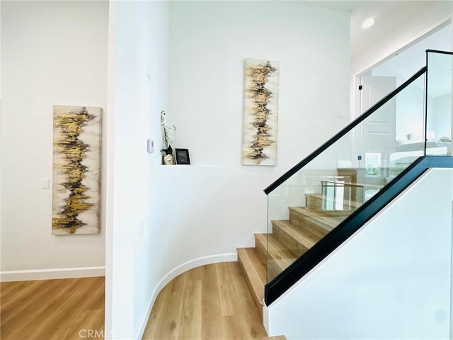 83 Palm Beach Ct, Dana Point, CA 92629 - staircase with wood finished floors and baseboards