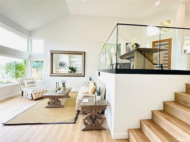 83 Palm Beach Ct, Dana Point, CA 92629 - living area featuring wood finished floors, stairs, and vaulted ceiling