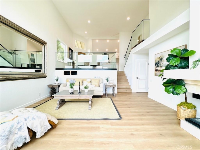 83 Palm Beach Ct, Dana Point, CA 92629 - living room with wood finished floors, stairway, and recessed lighting