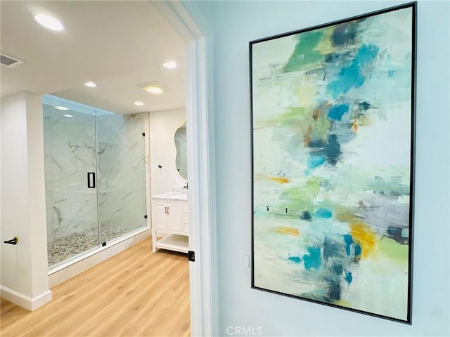 83 Palm Beach Ct, Dana Point, CA 92629 - full bath featuring wood finished floors, a marble finish shower, vanity, and recessed lighting