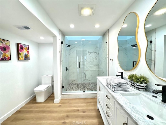 83 Palm Beach Ct, Dana Point, CA 92629 - bathroom featuring vanity, a marble finish shower, wood finished floors, and recessed lighting