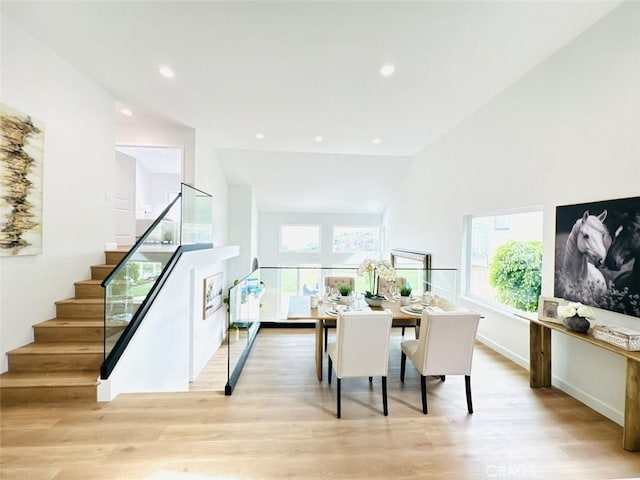 83 Palm Beach Ct, Dana Point, CA 92629 - dining area featuring vaulted ceiling, wood finished floors, stairs, and recessed lighting