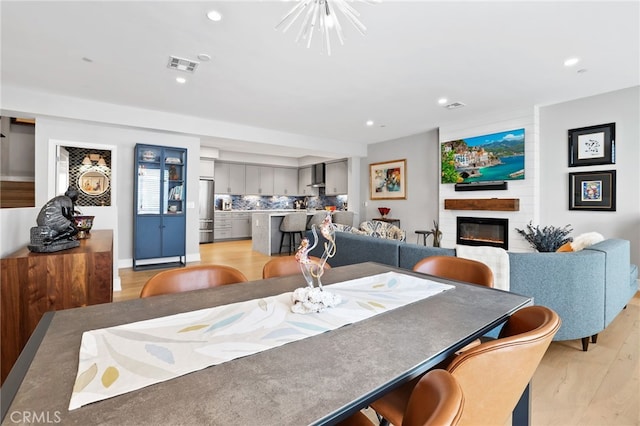 1920 S Pacific Coast Hwy, Redondo Beach, CA 90277 - dining room with a fireplace, light wood-style floors, and recessed lighting