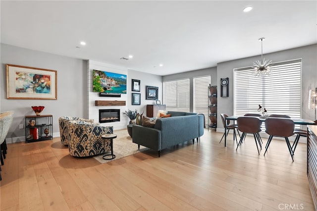 1920 S Pacific Coast Hwy, Redondo Beach, CA 90277 - living room with a large fireplace, light wood finished floors, and recessed lighting