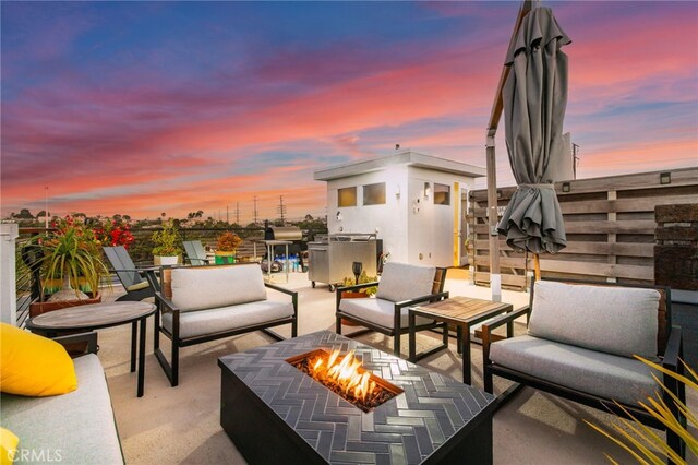 1920 S Pacific Coast Hwy, Redondo Beach, CA 90277 - patio terrace at dusk featuring an outdoor fire pit and a patio