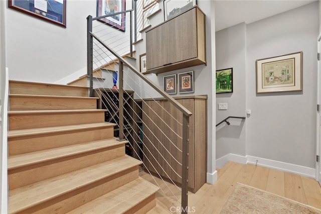 1920 S Pacific Coast Hwy, Redondo Beach, CA 90277 - staircase with hardwood / wood-style flooring and baseboards
