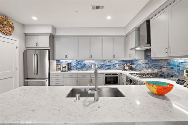 1920 S Pacific Coast Hwy, Redondo Beach, CA 90277 - kitchen with stainless steel appliances, wall chimney range hood, light stone counters, gray cabinetry, and recessed lighting