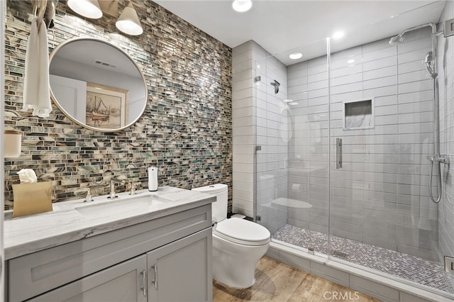 1920 S Pacific Coast Hwy, Redondo Beach, CA 90277 - full bathroom with a stall shower, vanity, wood finished floors, tile walls, and tasteful backsplash