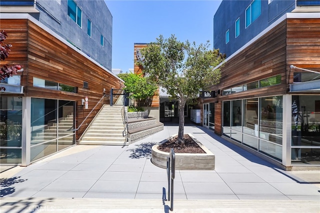 1920 S Pacific Coast Hwy, Redondo Beach, CA 90277 - view of property's community featuring an outdoor fire pit, a patio area, and stairway