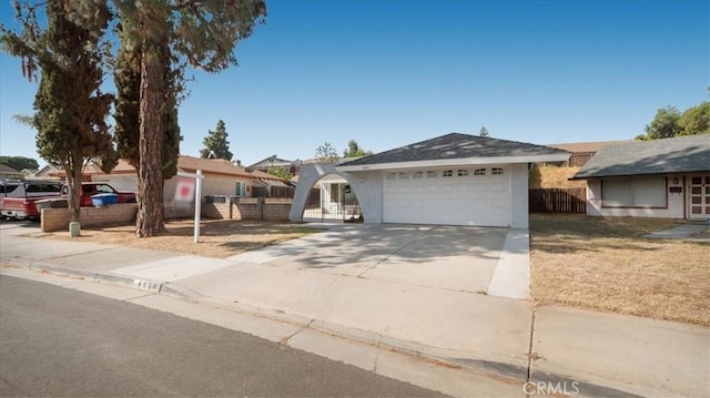 4440 Daniel Dr, Riverside, CA 92503 - ranch-style house with driveway, a garage, and stucco siding