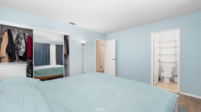 4440 Daniel Dr, Riverside, CA 92503 - bedroom featuring wood finished floors, a closet, and ensuite bath