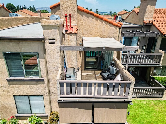 3069 Brea Blvd Unit 10, Fullerton, CA 92835 - rear view of house with a balcony and stucco siding