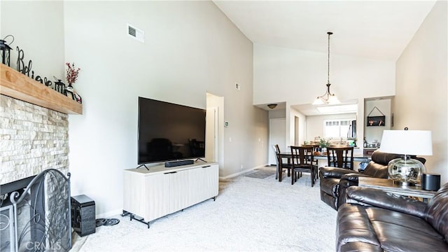 3069 Brea Blvd Unit 10, Fullerton, CA 92835 - living area with light carpet, high vaulted ceiling, and a stone fireplace