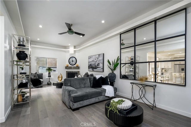 4557 Don Timoteo Dr, Los Angeles, CA 90008 - living area featuring a ceiling fan, wood finished floors, recessed lighting, and a fireplace