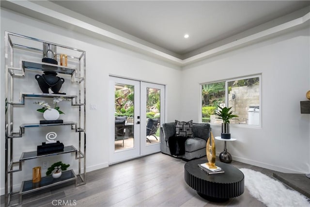 4557 Don Timoteo Dr, Los Angeles, CA 90008 - sitting room with french doors, healthy amount of natural light, wood finished floors, and recessed lighting