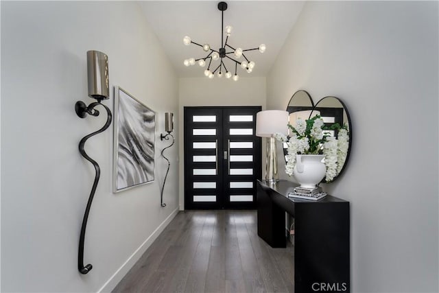 4557 Don Timoteo Dr, Los Angeles, CA 90008 - entryway featuring a chandelier, wood finished floors, and lofted ceiling