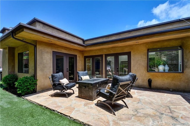 4557 Don Timoteo Dr, Los Angeles, CA 90008 - view of patio / terrace featuring french doors and a fire pit